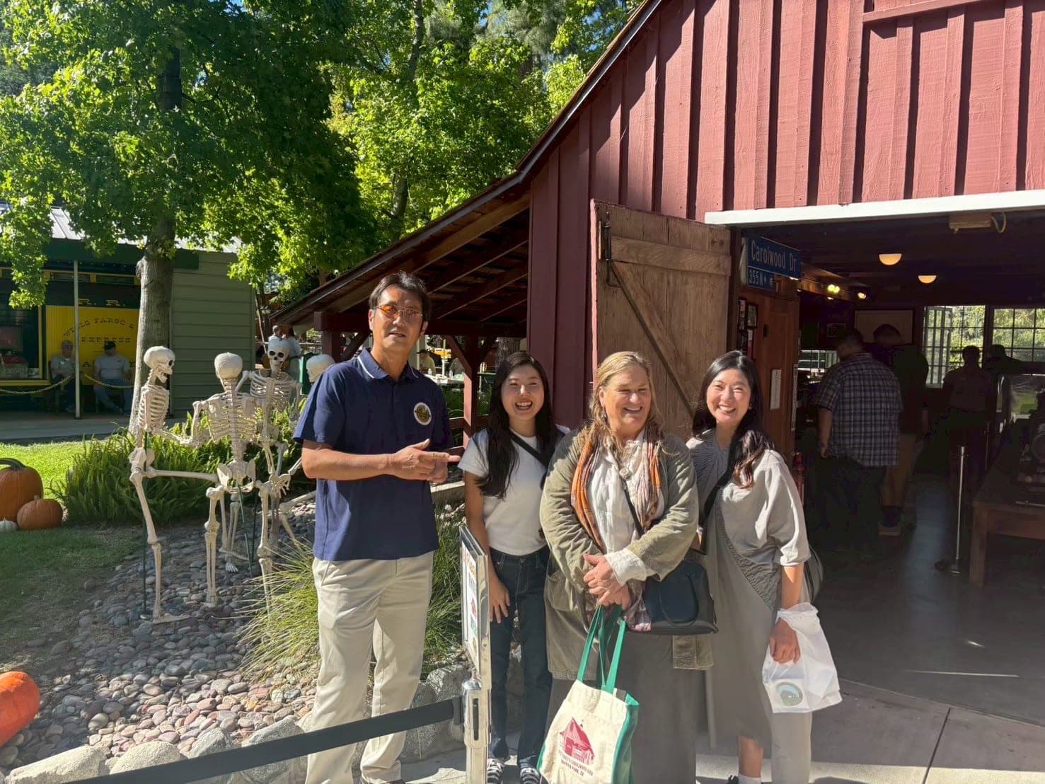 A commemorative photo with guests at a location connected to Walt Disney.